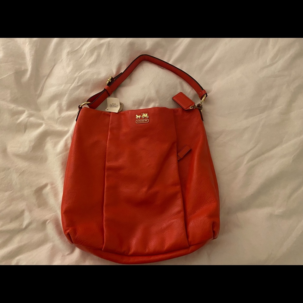 New with tags coach purse.